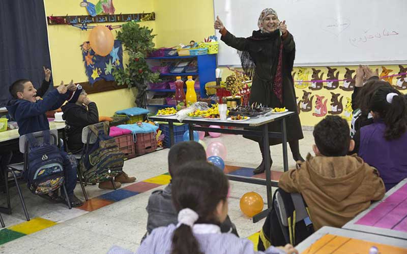 Hanan Al Hroub menulis buku We Play and Learn, untuk mempromosikan metode pengajaran non-kekerasan